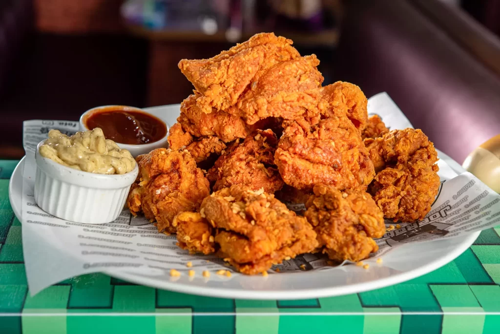 Coxa e Sobrecoxa de frango empanado